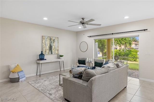 living room featuring ceiling fan and light tile patterned flooring