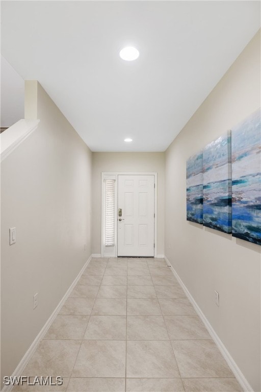 entryway with light tile patterned floors