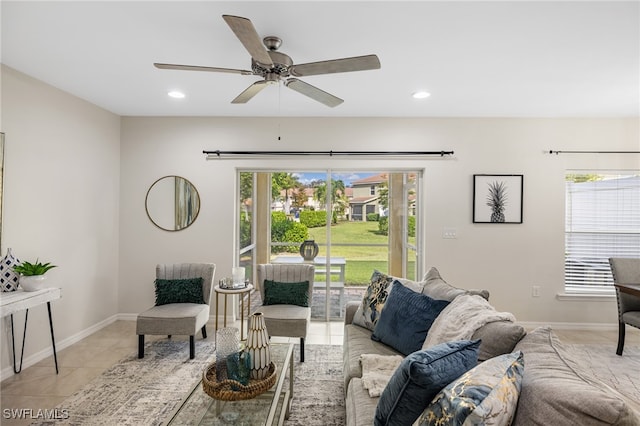 living room with ceiling fan and light tile patterned floors