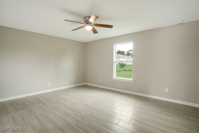 unfurnished room featuring light wood-type flooring and ceiling fan