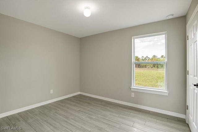 spare room featuring light wood-type flooring