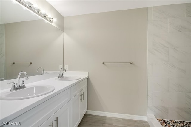 bathroom featuring vanity and hardwood / wood-style floors