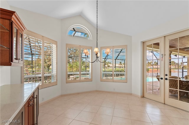 interior space featuring french doors, plenty of natural light, and lofted ceiling