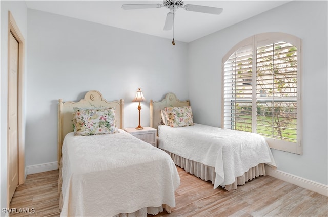 bedroom featuring ceiling fan and light hardwood / wood-style flooring