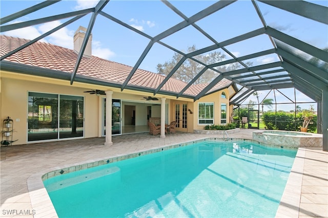 view of pool with ceiling fan, a patio area, a lanai, and an in ground hot tub