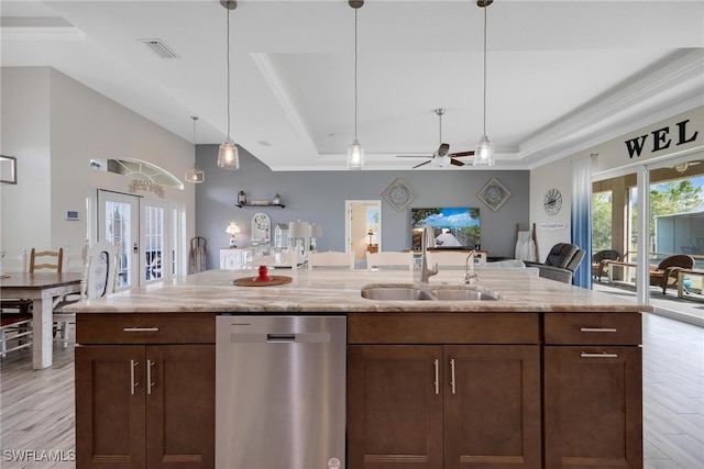 kitchen featuring dishwasher, light hardwood / wood-style flooring, sink, light stone counters, and ceiling fan