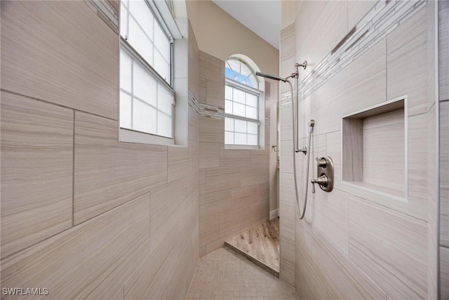 bathroom featuring a tile shower