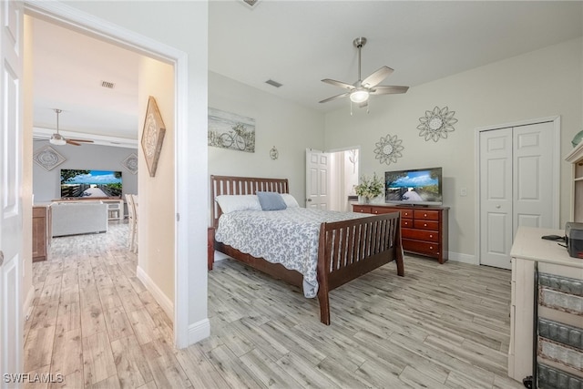 bedroom with a closet, ceiling fan, and light wood-type flooring