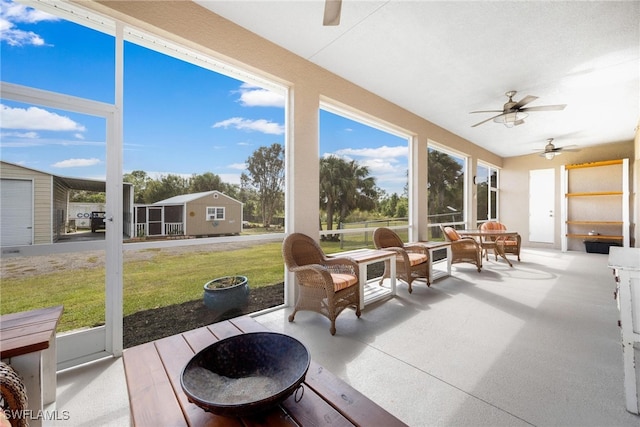 sunroom / solarium with ceiling fan