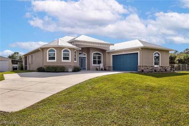 view of front facade with a garage and a front lawn