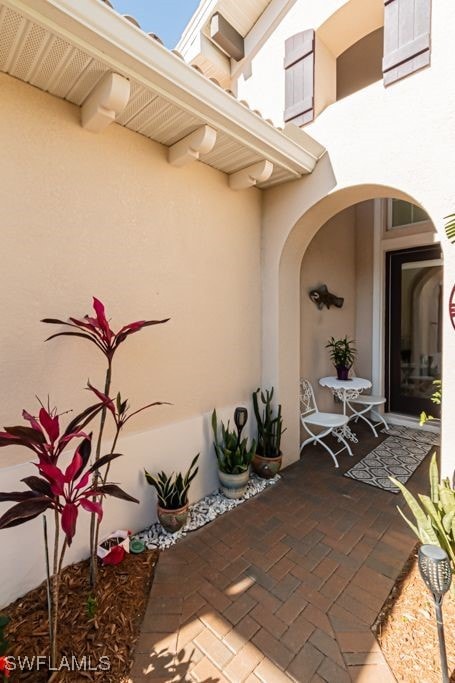 doorway to property featuring a patio area