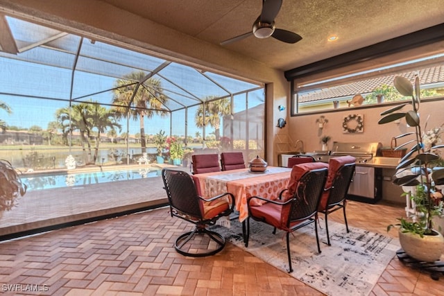 sunroom / solarium featuring ceiling fan