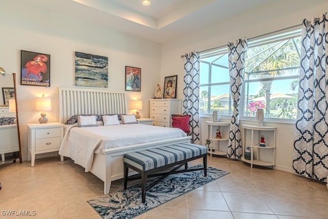 tiled bedroom featuring multiple windows