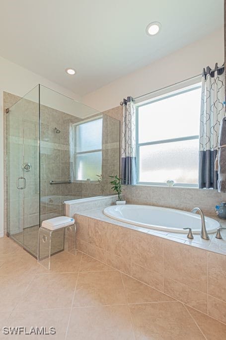 bathroom featuring separate shower and tub and tile patterned flooring