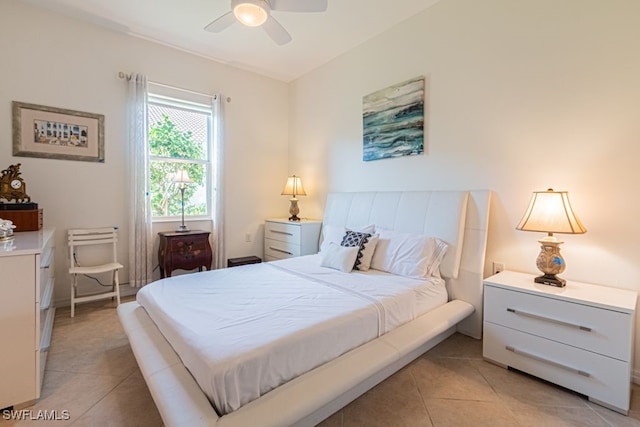 tiled bedroom with ceiling fan