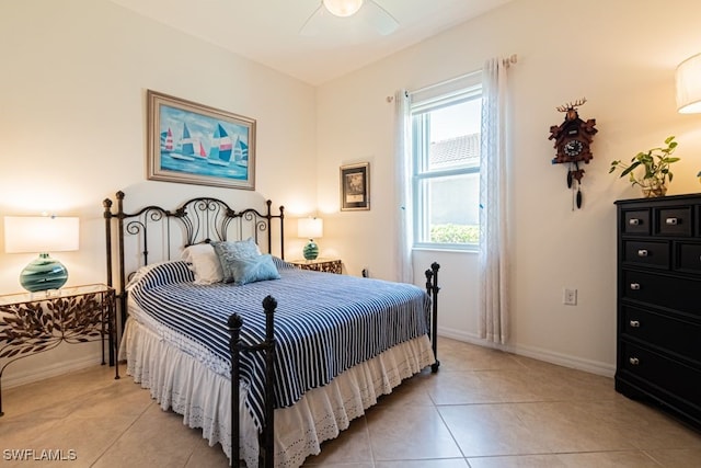 tiled bedroom with ceiling fan