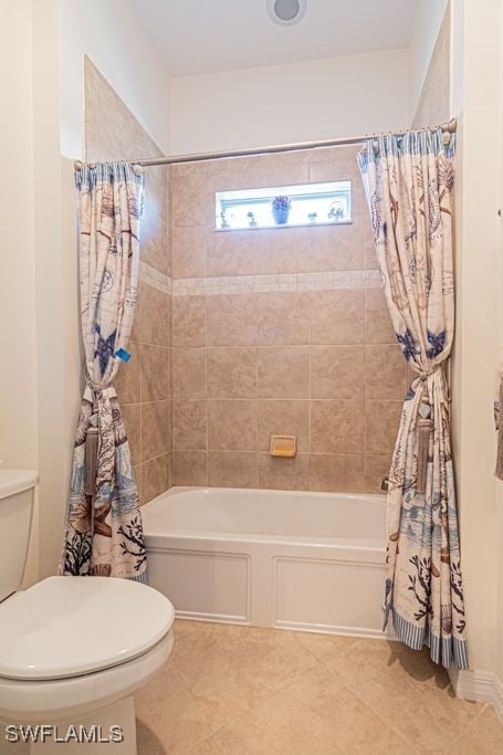 bathroom featuring toilet, shower / bathtub combination with curtain, and tile patterned floors