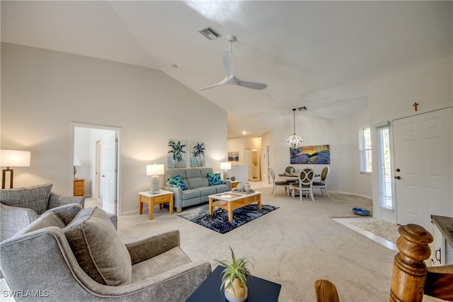 living room featuring ceiling fan, carpet flooring, and lofted ceiling