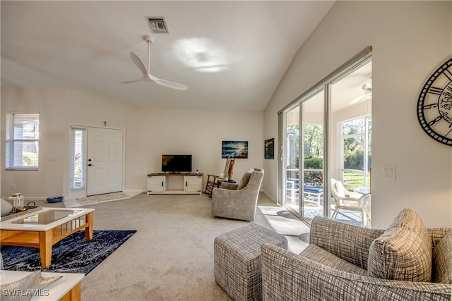 living room featuring light carpet, lofted ceiling, and ceiling fan