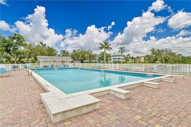 view of swimming pool featuring a patio area