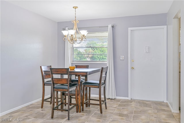 dining room featuring a chandelier