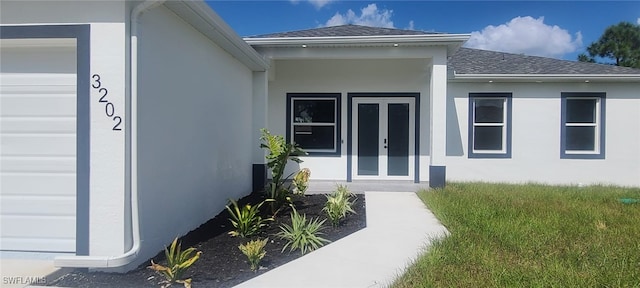 doorway to property with french doors and a garage