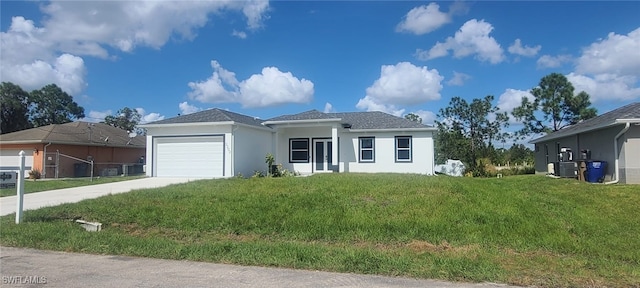 single story home featuring cooling unit, a front lawn, and a garage