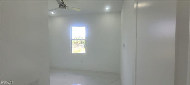 unfurnished room featuring ceiling fan