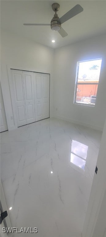 unfurnished bedroom featuring a closet and ceiling fan