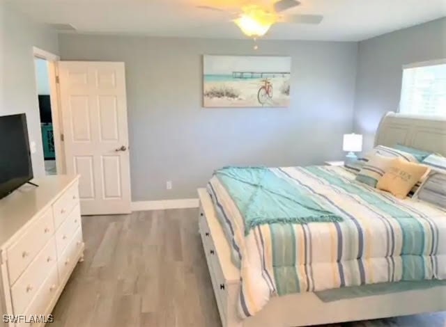 bedroom featuring ceiling fan and light hardwood / wood-style flooring