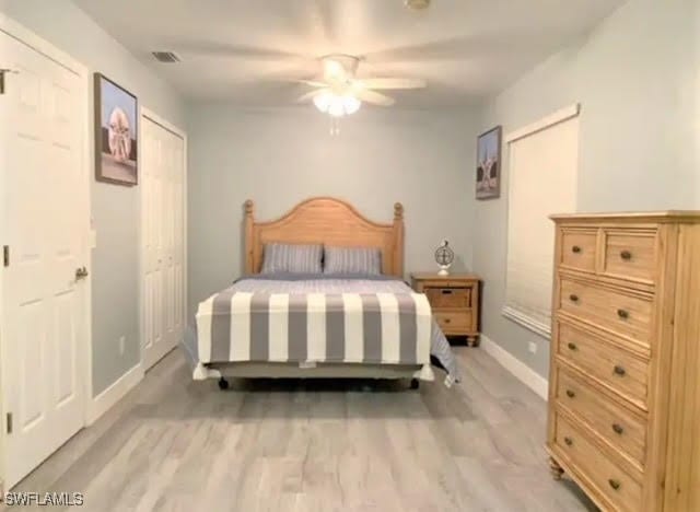 bedroom featuring ceiling fan and light wood-type flooring