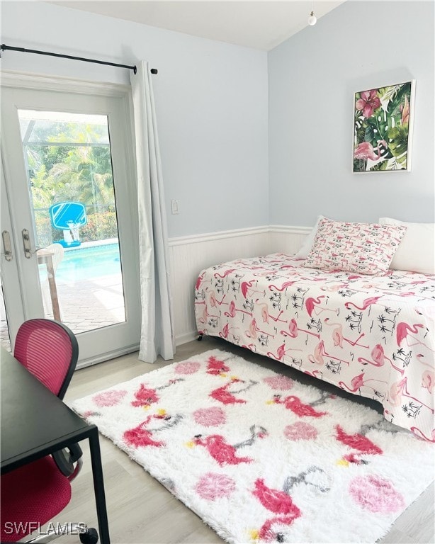 bedroom with hardwood / wood-style floors