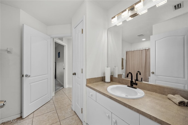 bathroom with vanity and tile patterned flooring