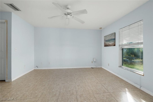 3615 4th St SW, Lehigh Acres, FL 33976 - spare room featuring ceiling fan, baseboards, and light tile patterned flooring