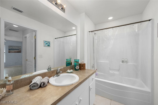 bathroom with vanity, shower / bath combo with shower curtain, and tile patterned floors