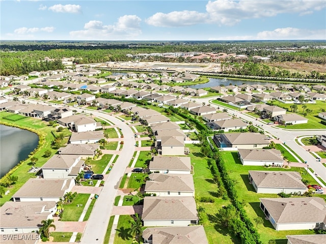 aerial view with a water view and a residential view