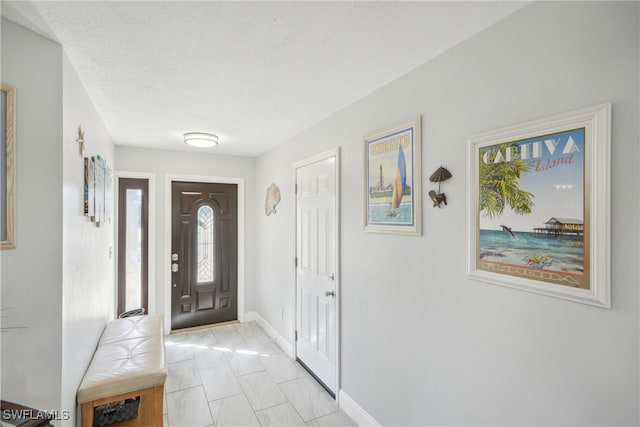 entrance foyer with a textured ceiling