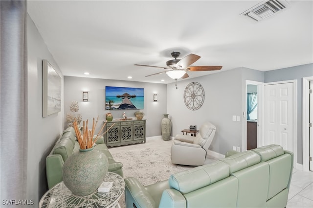 living room featuring light tile patterned flooring and ceiling fan