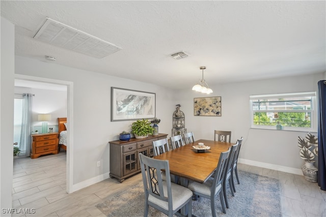 dining room with a textured ceiling