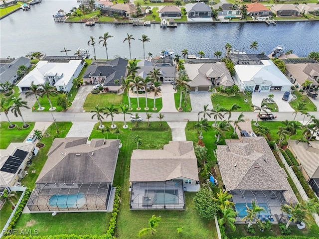 birds eye view of property with a water view