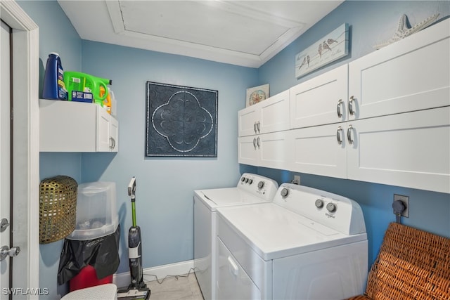 laundry area featuring cabinets and separate washer and dryer