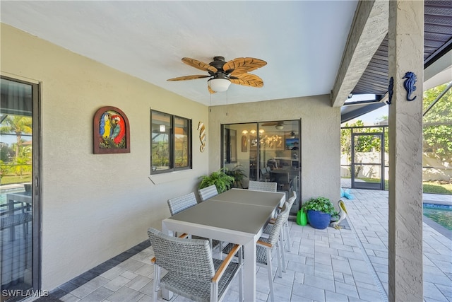 view of patio / terrace featuring a lanai and ceiling fan