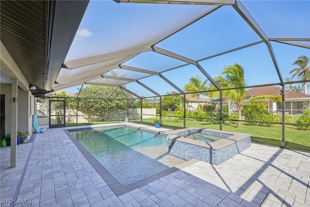 view of pool featuring an in ground hot tub, a yard, a patio, and a lanai