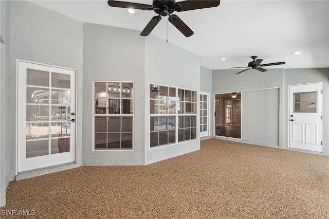 interior space with ceiling fan and lofted ceiling