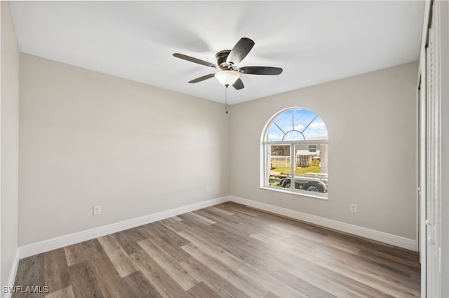 spare room featuring ceiling fan and light wood-type flooring