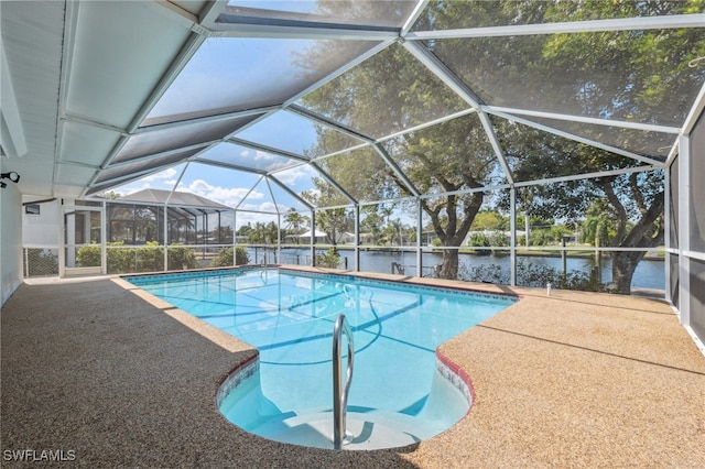 view of swimming pool featuring a lanai, a patio, and a water view