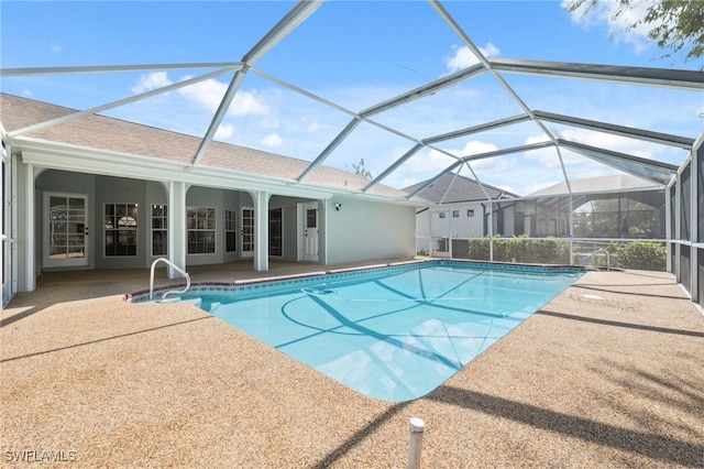 view of pool featuring a patio area and a lanai