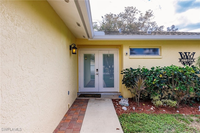 property entrance featuring french doors