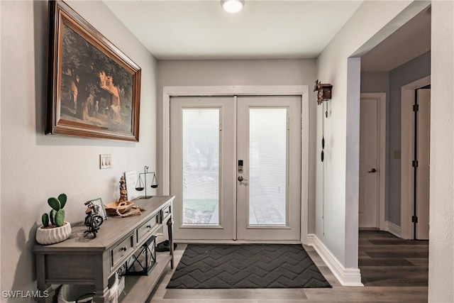 doorway to outside with french doors and wood-type flooring