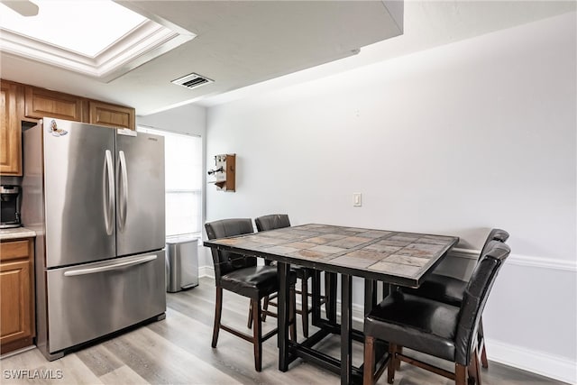 dining space featuring light hardwood / wood-style floors